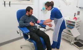 A patient receiving treatment in the therapy chair