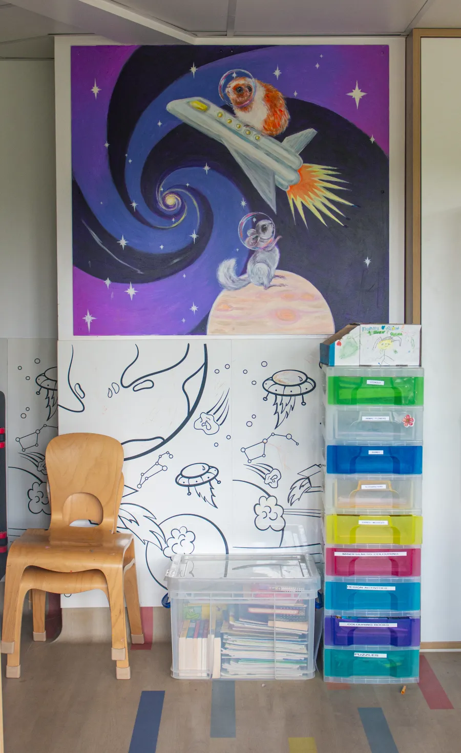 A space mural with a rocket