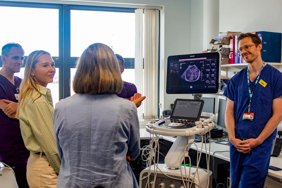 King’s researchers, charity supporters, and Daria Bukhman during a demonstration of new neonatal equipment