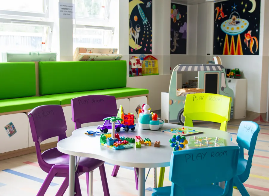 The playroom table covered in lego