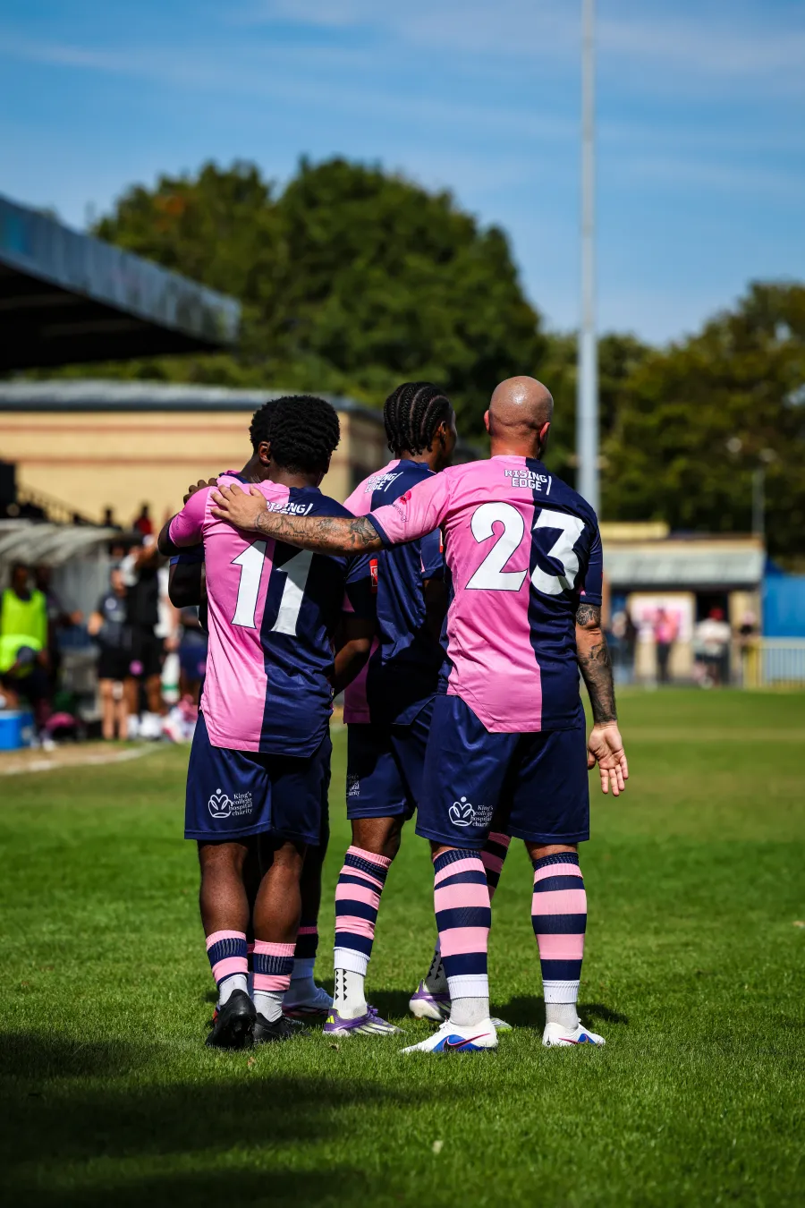 Dulwich Hamlet FC footballers celebrating a goal