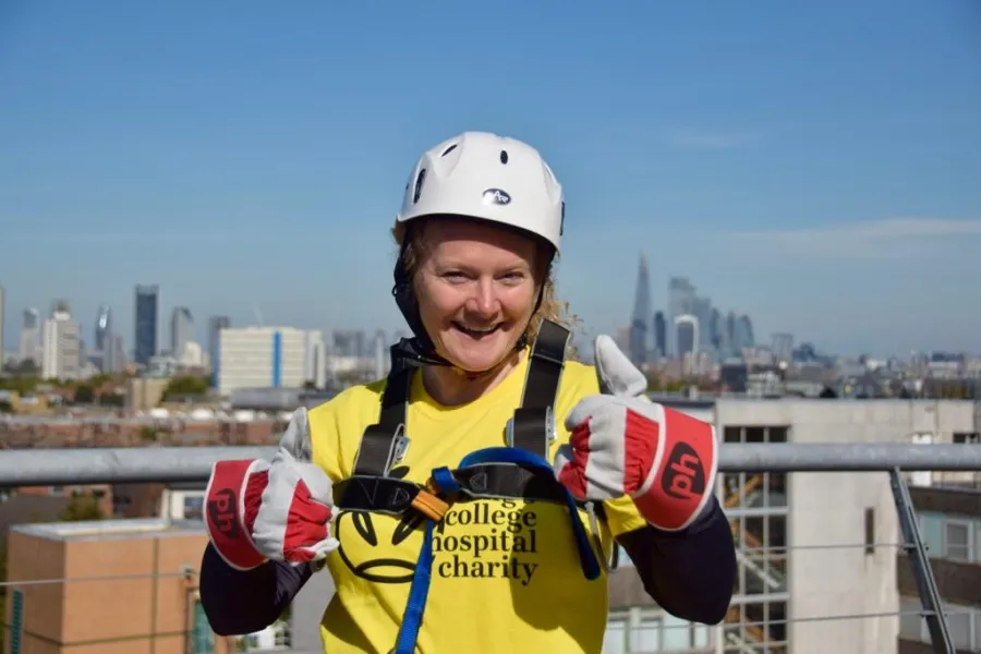 Gail with her thumbs up wearing a King's College Hospital Charity t-shirt wearing safety equipment