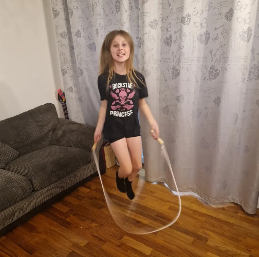 Bebe skipping in her living room
