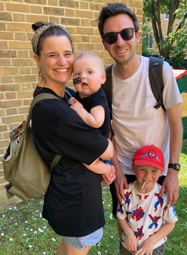 Jo with her husband James and two sons Arthur and Finley