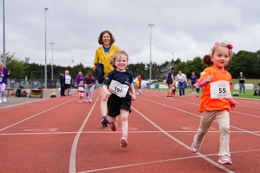 Small children running in a track race