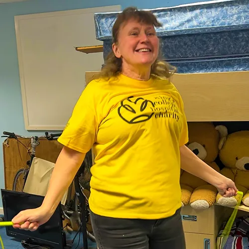 A woman in a King's t-shirt skipping