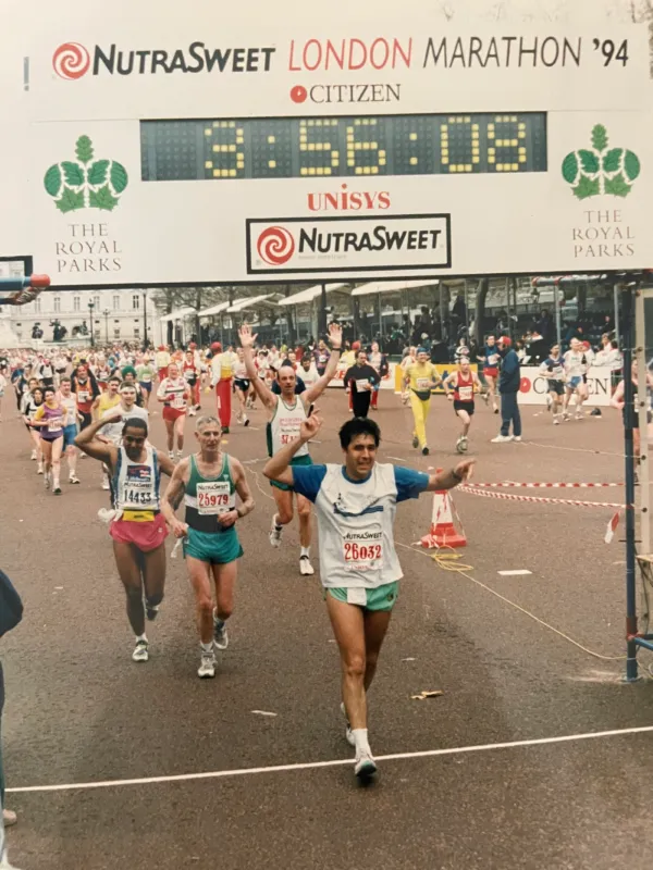 Graham crossing the finish line at the 1994 London Marathon