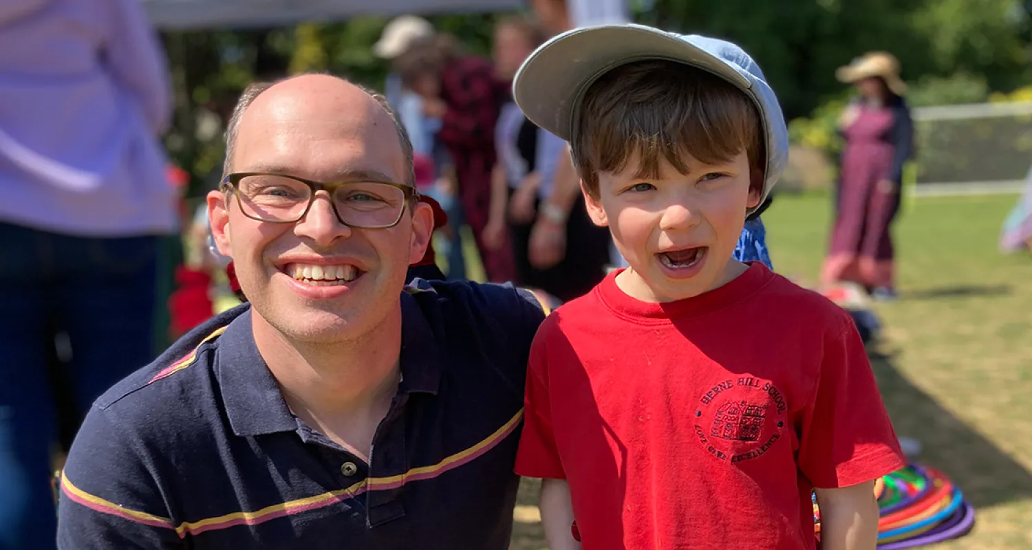 Euan and his son smiling outside
