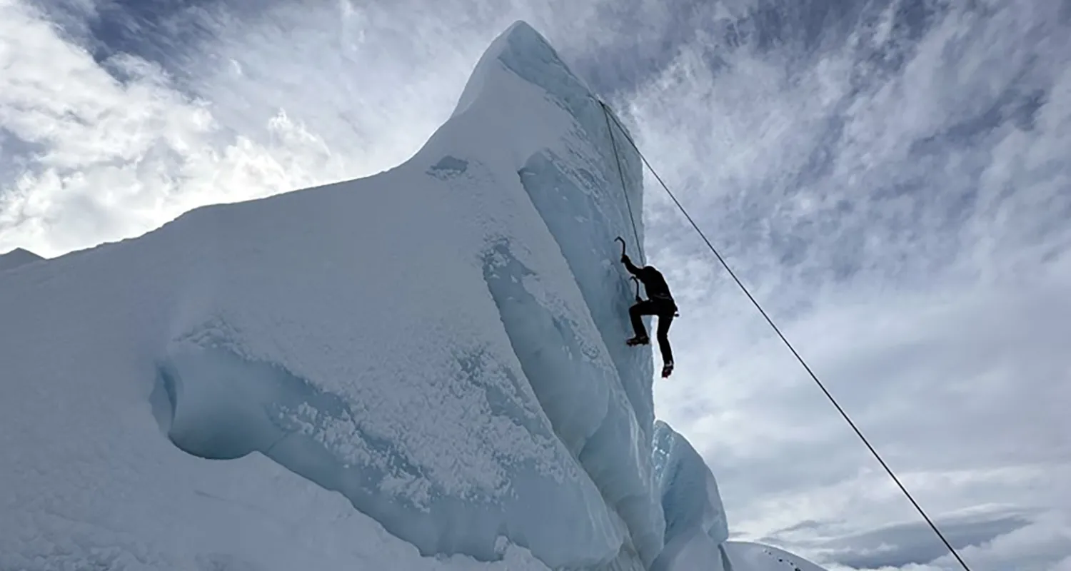 Bassel suspended high from an icy mountain 