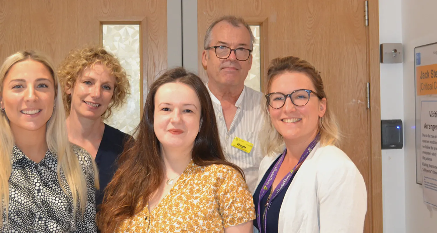 Picture of five members of King's psychosocial team standing outside the critical care unit