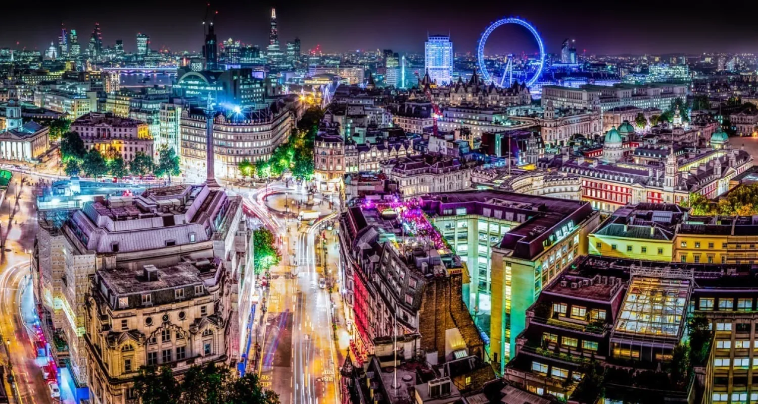 A landscape picture of Central London lit up with lights