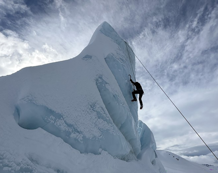 Bassel suspended high from an icy mountain 