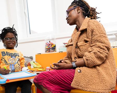 Image of mother and son enjoying a newly refurbished playroom 