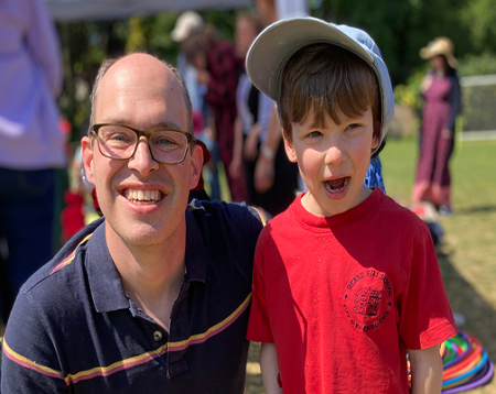 Euan and his son smiling outside