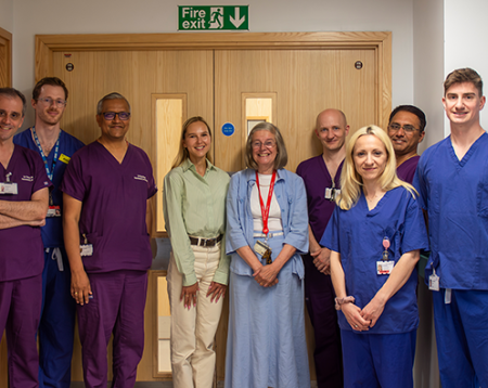 Group of clinical staff, charity representatives, and Daria Bukhman standing outside the neonatal ward