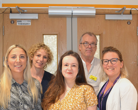 Picture of five members of King's psychosocial team standing outside the critcal care unit