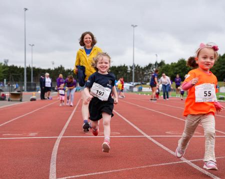 Small children running in a track race