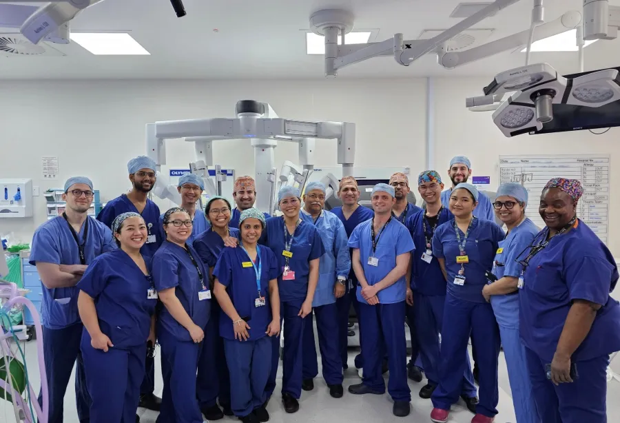 Doctors next to the King's surgical robot