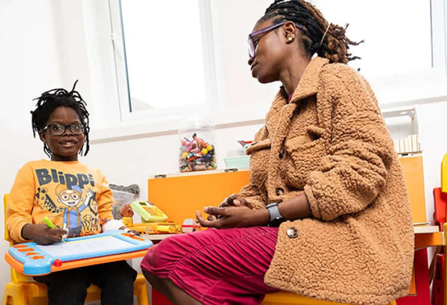 Image of mother and son enjoying a newly refurbished playroom 