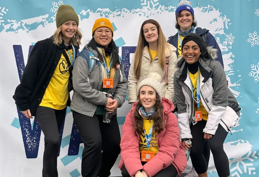 a group of 6 ladies posing with medals