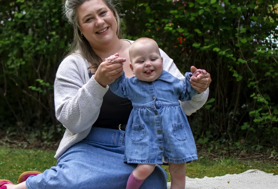 Elizabeth outside with her daughter Ava