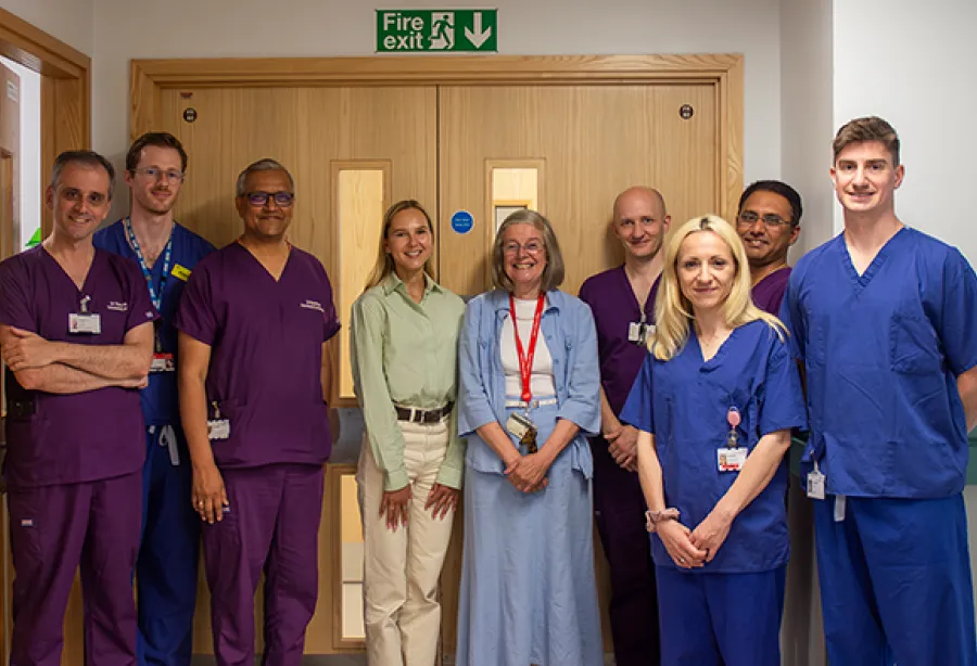 Group of clinical staff, charity representatives, and Daria Bukhman standing outside the neonatal ward