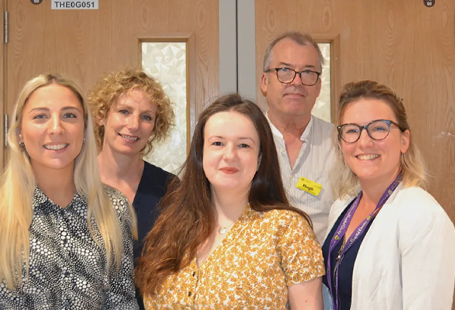Picture of five members of King's psychosocial team standing outside the critcal care unit